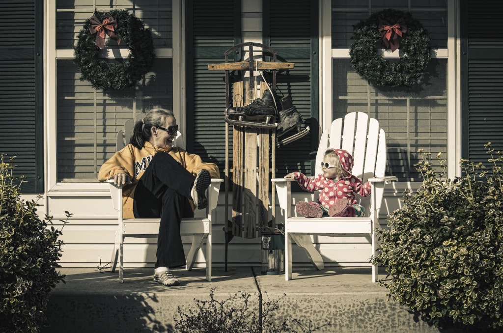 Grandma and Ames in porch chairs